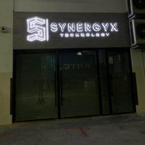 lightbox signage with the wording "synergy X technology"