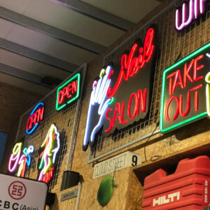 various neon signs with different wording