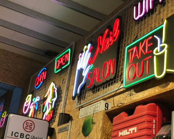 various neon signs with different wording